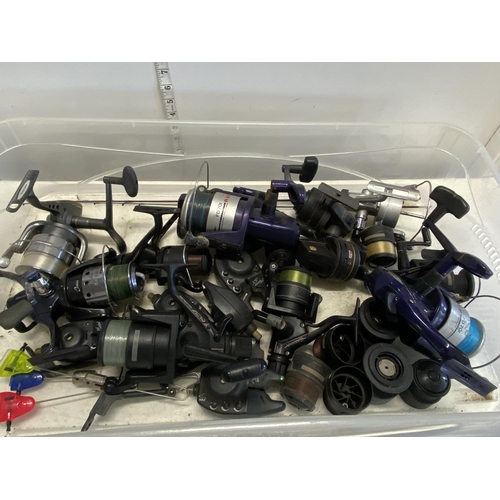 A box full of assorted fishing reels and accessories etc