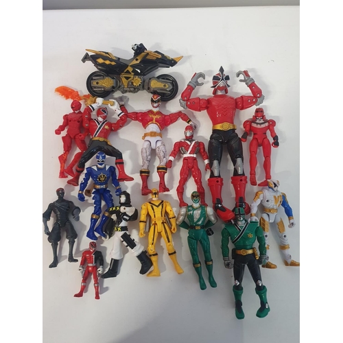 A box full of assorted Power Ranger figures