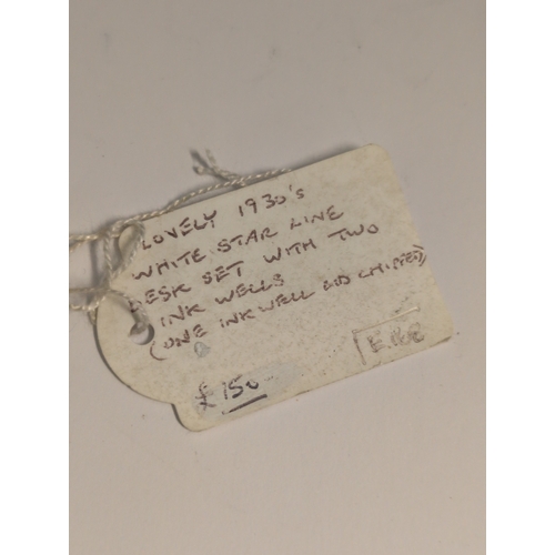 93 - A 1930s White Star Line Art Deco Black Desk Set with Two Inkwells