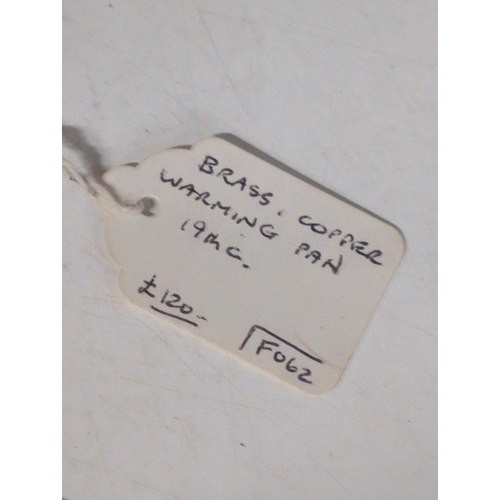 166 - A 19th Century Brass and Copper Bed Warmer and a Brass Rolling Rule from the S.S. President Coolidge... 