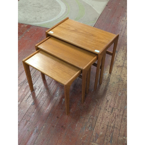 82A - A Set of Three Mid-Century Modern Danish Teak Nesting Tables. 49cm Tall. Shipping Unavailable