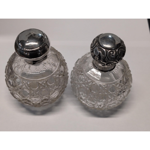 148 - A Pair of Late Victorian/Edwardian Cut Glass and Sterling Silver Vanity Bottles. 11.5cm H, 8.5cm dia