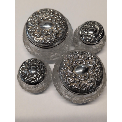 149 - A Set of Four Edwardian Sterling Silver and Cut Glass Dressing Table Jars, London 1906 / Birmingham ... 