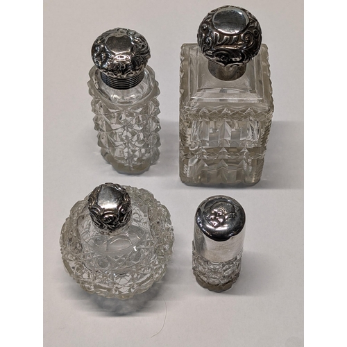 150 - A Group of Victorian and Edwardian Sterling Silver and Cut Glass Scent Bottles. Tallest H 12cm