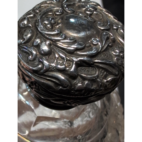 151 - Two Edwardian English Sterling Silver and Cut Glass Lidded Bottles. H 9cm, 7cm dia