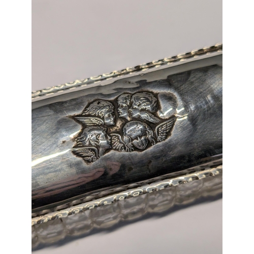 153 - Two English Sterling Silver and Cut Glass Repousse Dresser Boxes. Large H 4.5cm, L 12cm, W 6cm. Smal... 