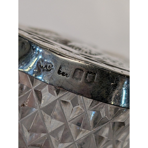 153 - Two English Sterling Silver and Cut Glass Repousse Dresser Boxes. Large H 4.5cm, L 12cm, W 6cm. Smal... 