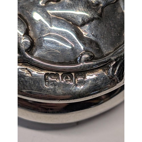 154 - An Art Nouveau Sterling Silver Pillbox with Cherub Motif William Comyns London 1900 29g