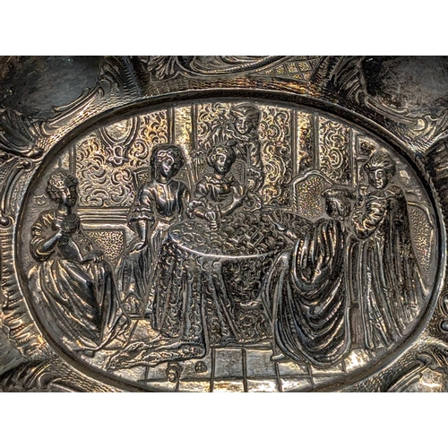 164 - Exeter 1862? Silver Repoussé Dish with Figural Putti Handles. H 3.5cm, L 19cm, W 13cm 148g