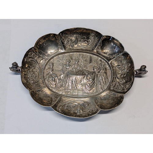 164 - Exeter 1862? Silver Repoussé Dish with Figural Putti Handles. H 3.5cm, L 19cm, W 13cm 148g