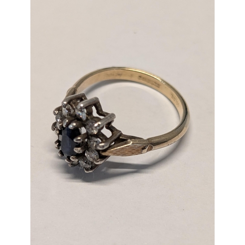 142 - An 925 Cased in 18ct (GOLSIL) Tone Sapphire Cluster Ring 3.19g