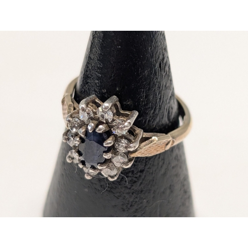 142 - An 925 Cased in 18ct (GOLSIL) Tone Sapphire Cluster Ring 3.19g