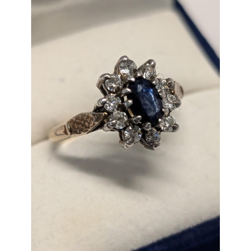 142 - An 925 Cased in 18ct (GOLSIL) Tone Sapphire Cluster Ring 3.19g