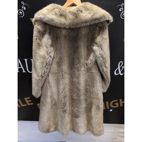 125 - An Astraka Fur Coat, Made in England