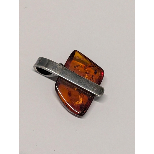 149 - A Sterling Silver and Baltic Amber Pendant