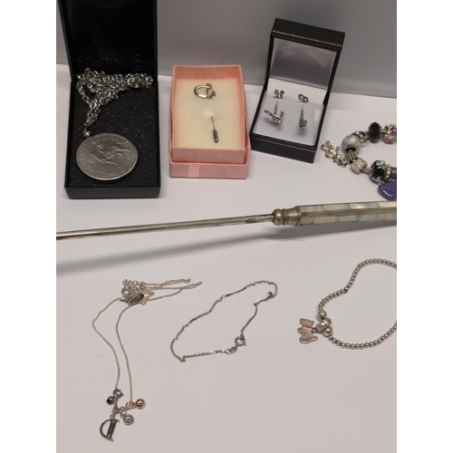 150 - An MOP Handle Candle Snuffer And Other Including Sterling Silver