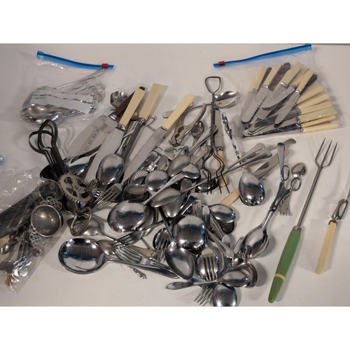 74 - A Large Assortment of Mixed Cutlery and Kitchen Utensils, including Silverplate and Stainless Steel,... 
