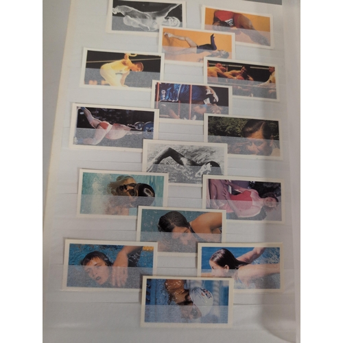 98 - A Stockbook with Picture Card Collection, Booklets, and Laminated Cards