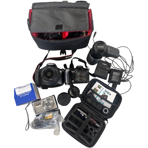 An Assortment of Digital Cameras and Photographic Accessories including ...