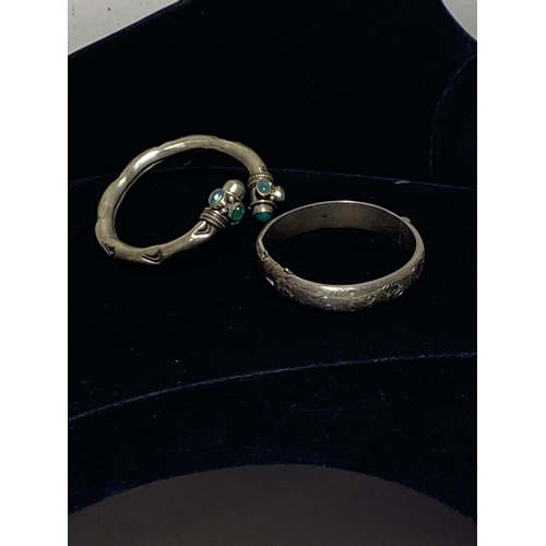 114 - Two Bangles including an Edwardian Hallmarked Sterling Silver Engraved Bangle and a Gemset White Met... 