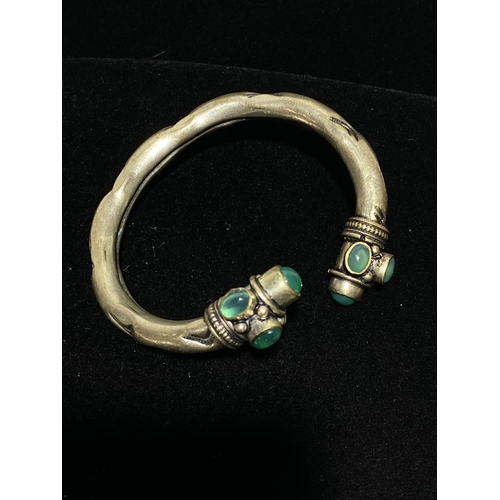 114 - Two Bangles including an Edwardian Hallmarked Sterling Silver Engraved Bangle and a Gemset White Met... 