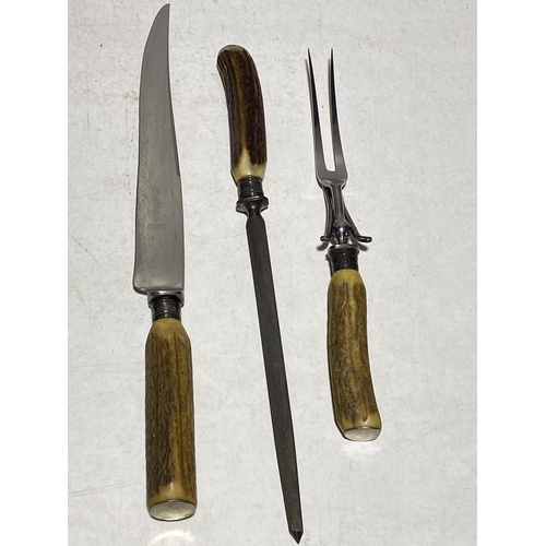 35 - An early 20th Century Antler Handle Carving Set Pieces by W.R. Humphreys and Co Ltd