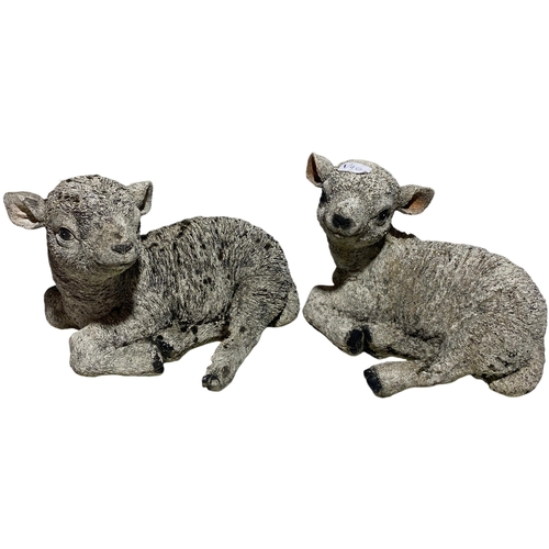 66 - A Pair of Cast Composite Recumbent Lamb Garden Ornaments. 26cm x 34cm. No shipping.