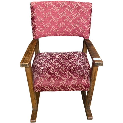 61 - An Early 20th Century Arts & Crafts Style Oak child's rocking Chair. 57cm tall. No shipping.