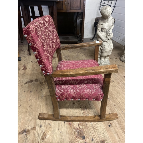 61 - An Early 20th Century Arts & Crafts Style Oak child's rocking Chair. 57cm tall. No shipping.