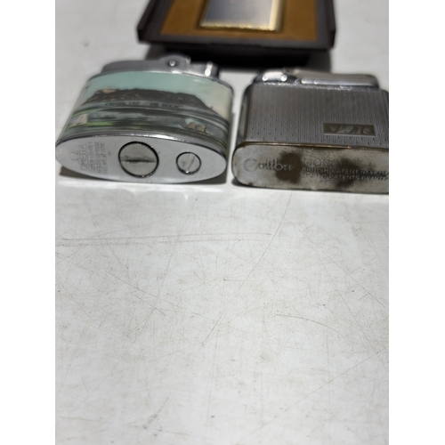 142 - A Trio of Vintage Pocket Lighters by Win International, Colibri and Omega