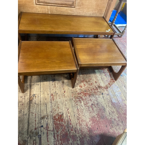 84 - A Trio of Mid-Century Teak Nesting Tables comprising of a coffee table ( 122cm x 46cm x 39cm) and tw... 