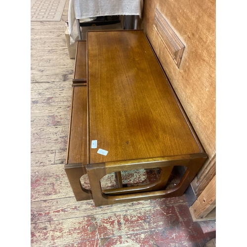 84 - A Trio of Mid-Century Teak Nesting Tables comprising of a coffee table ( 122cm x 46cm x 39cm) and tw... 