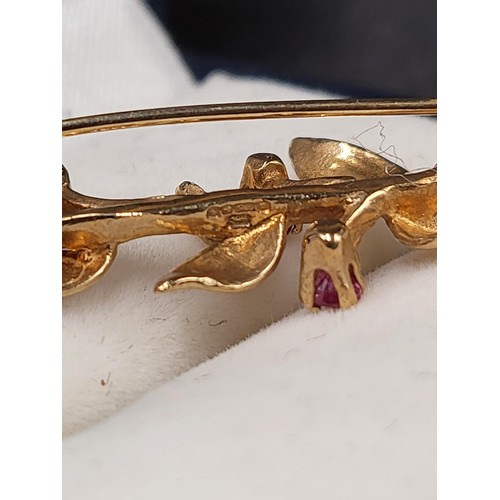 62 - 9ct Gold Flower & Ruby Brooch Fully Hallmarked Measures 3.5cm Long (Weight 2.1g)