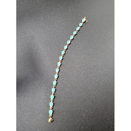 69 - 9ct Gold Fiery Opal Tennis Bracelet 17 Opals in Total Fully Hallmarked Measures 16cm unclasped (Weig... 