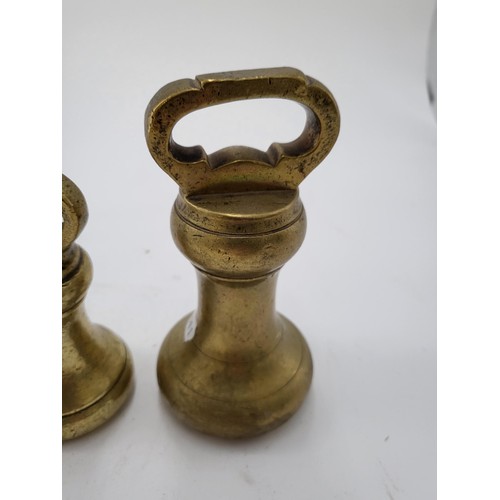 132 - Seven British Graduating Bell Weights Largest Measures 14cm Smallest Measure 3cm