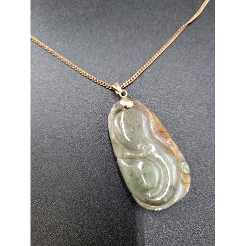 269 - Small Jade Pendant on a 9ct Gold Plated Chain Jade Measures 4.5cm Tall By 2.5cm Wide