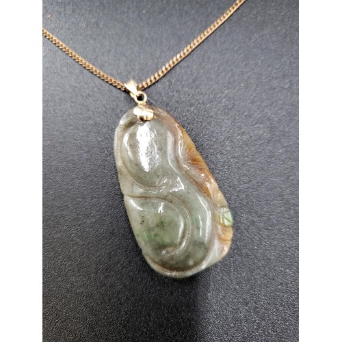 269 - Small Jade Pendant on a 9ct Gold Plated Chain Jade Measures 4.5cm Tall By 2.5cm Wide