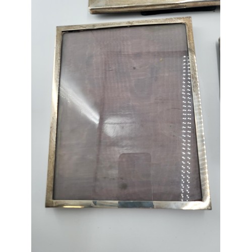 67 - Three Sterling Silver Photo Frames Measures Largest 24.5cm Tall by 24.5cm Wide Smallest 16cm tall by... 