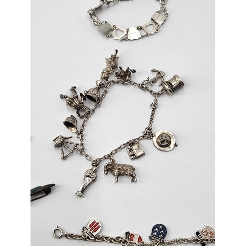 85 - Collection of Silver Charm Bracelets along with Two Brooches ( Total Weight 173g)
