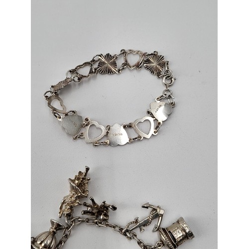 85 - Collection of Silver Charm Bracelets along with Two Brooches ( Total Weight 173g)