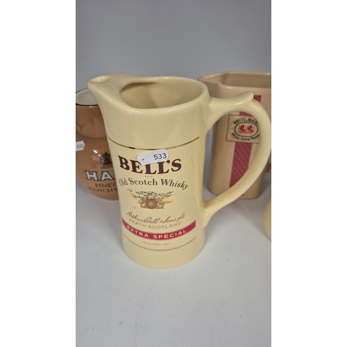 23 - Four Vintage Bell's, Haig & Whyte Mackay Whisky Water Jugs Height 19cm, 17cm & 16cm To Inclu... 