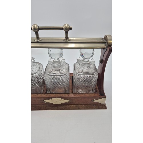 261 - Mahogany Tantalus with Three Crystal Decanters Length 38cmHeight 30cm