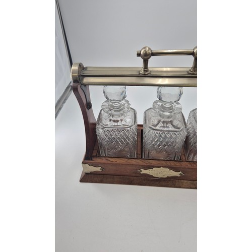 261 - Mahogany Tantalus with Three Crystal Decanters Length 38cmHeight 30cm