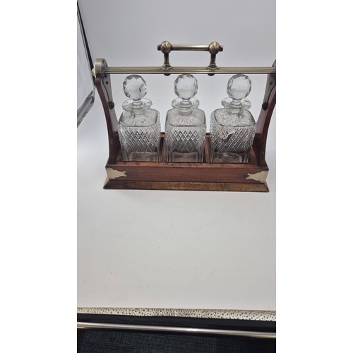 261 - Mahogany Tantalus with Three Crystal Decanters Length 38cmHeight 30cm