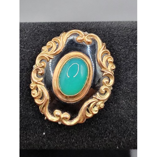 58 - Yellow Metal Brooch with Central Cabochon