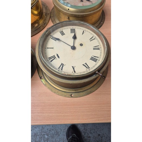 340 - Four Brass Bulkhead Clocks