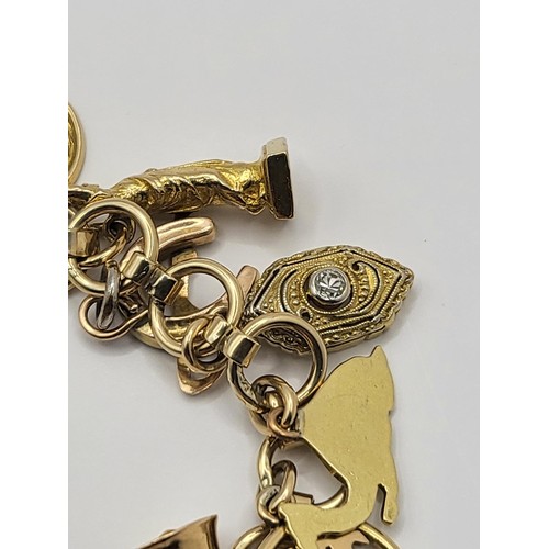 3 - 9ct Gold Charm Bracelet Weighs 28.4g Measures 16cm Long When Unclasped Fully Hallmarked