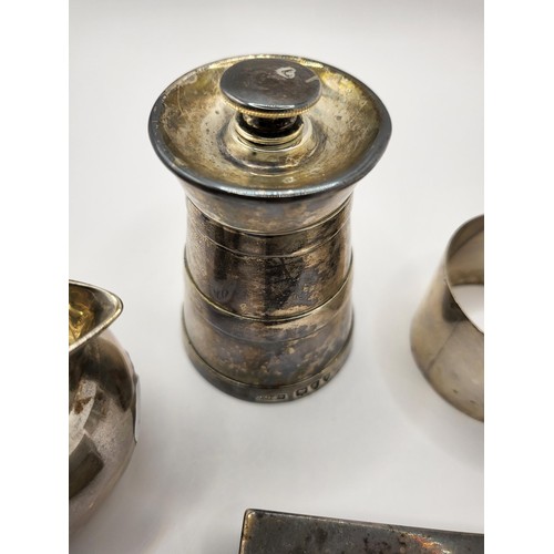 54 - Small Sterling Jug Along with Sterling Pepper Grinder, Two Sterling Napkin Rings, Matchbox Holder Th... 