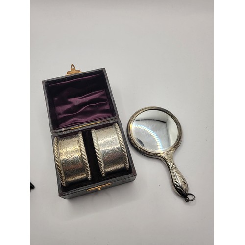 98 - Pair of Sterling Silver Cased Napkin Rings along with Small Miniature Sterling Mirror Napkins Weigh ... 