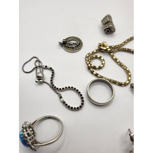 109 - Small Lot of Silver Jewellery Includes Necklace, Two Bracelets, Two Rings, Chest Charm